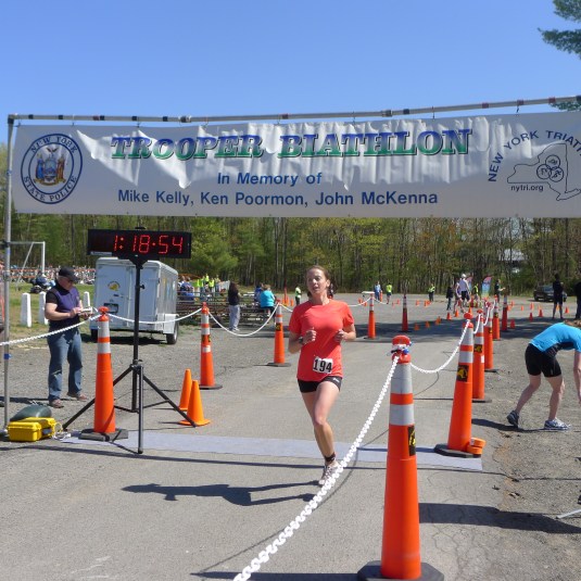 Meg finishing strong...And as it looks, me ducking out of the photo to hurl